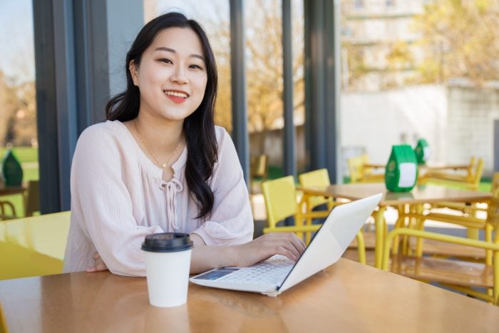 Korean young woman working on a laptop