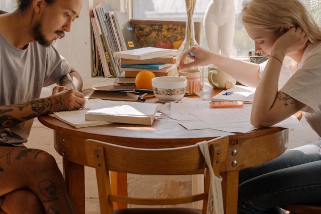 A couple studying in the kitchen